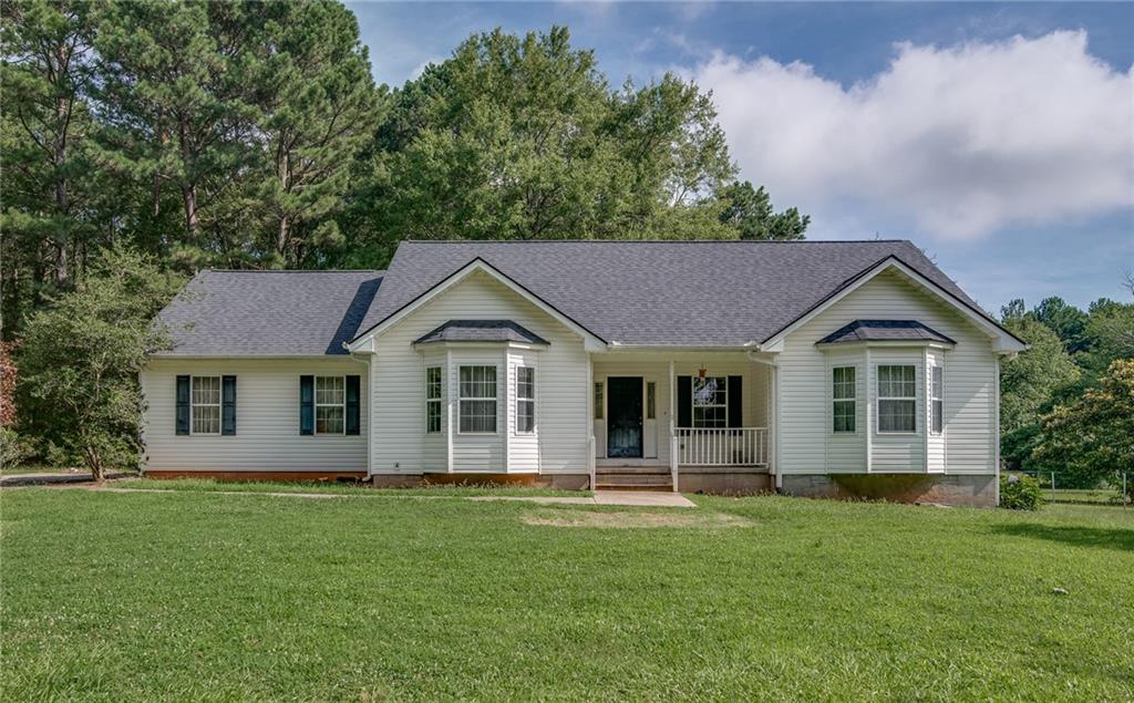 2720 Whitney Road Monroe, GA 30655 - Photo 1 of 1 a front view of a house with a garden