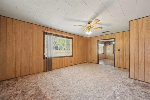 a view of a kitchen with a sink cabinets and wooden floor