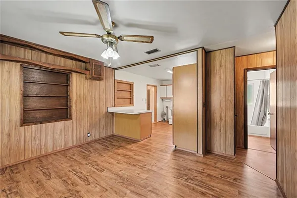a kitchen with a stove a sink and a window
