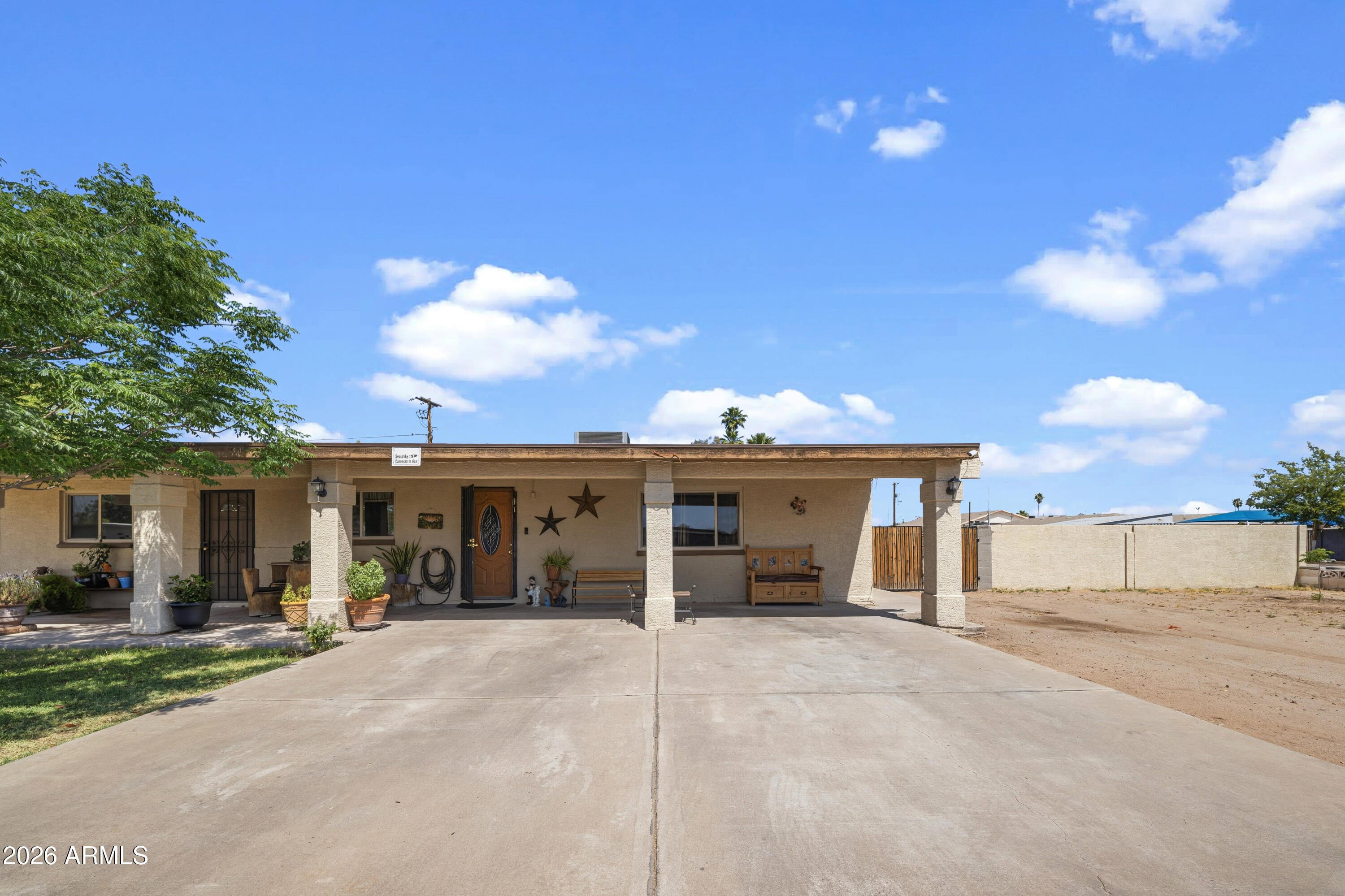 3902 West Monte Vista Road Phoenix, AZ 85009 - Photo 1 of 29 a view of a house with a backyard and porch