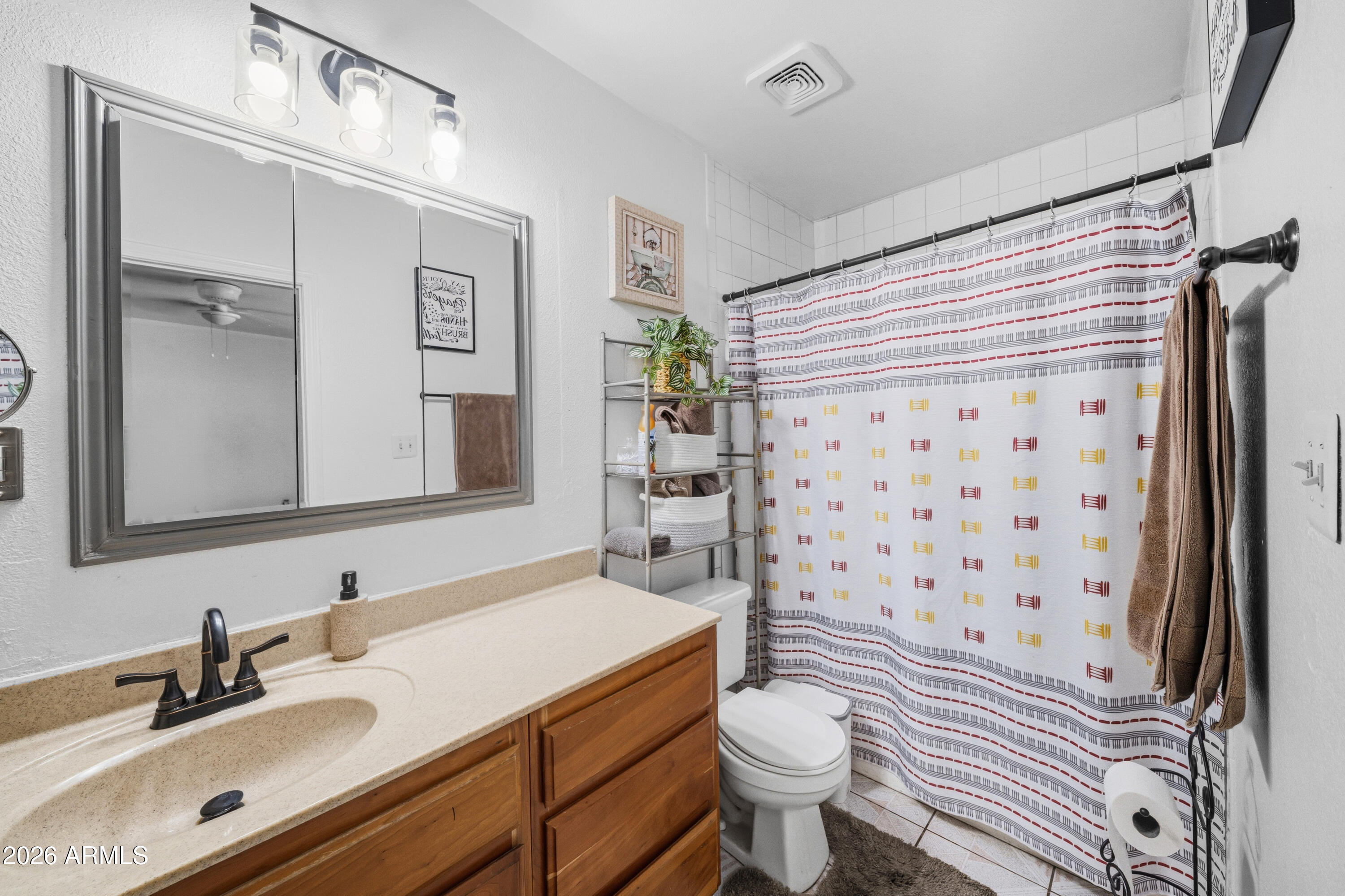 3902 West Monte Vista Road Phoenix, AZ 85009 - Photo 15 of 29 a bathroom with a sink toilet and shower