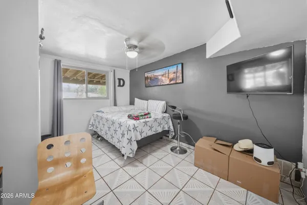 a bedroom with a bed and furniture