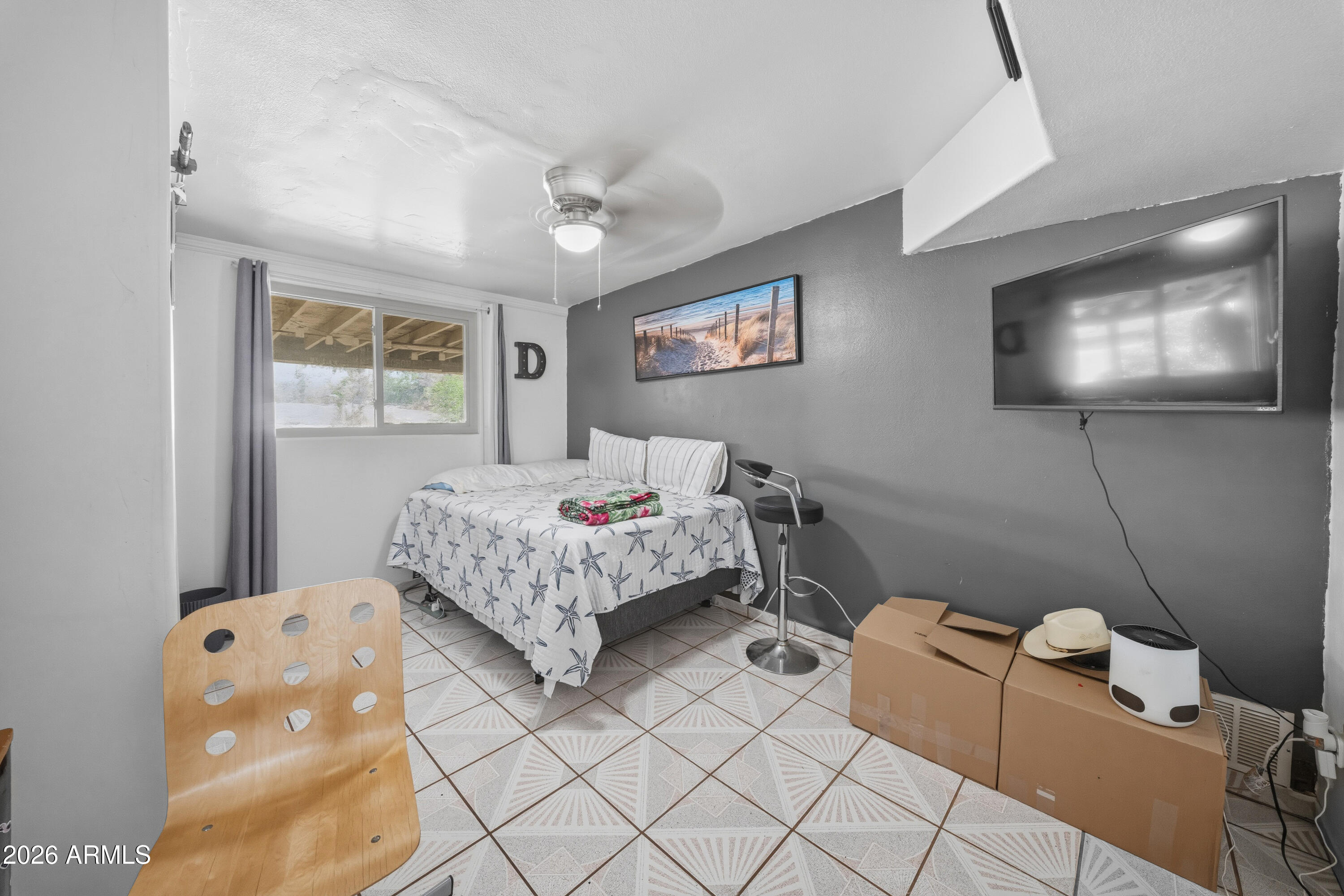 3902 West Monte Vista Road Phoenix, AZ 85009 - Photo 16 of 29 a bedroom with a bed and furniture