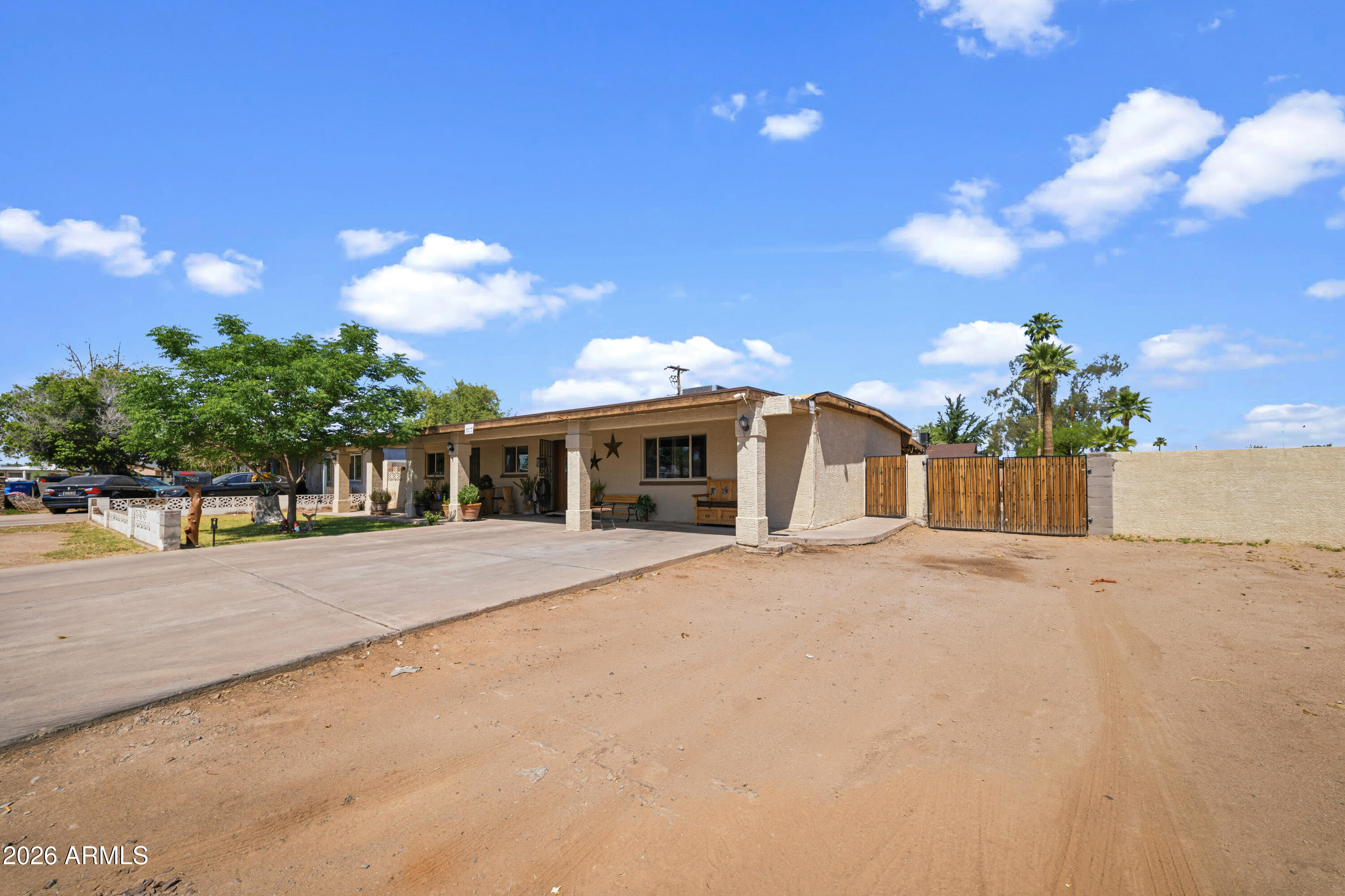 3902 West Monte Vista Road Phoenix, AZ 85009 - Photo 2 of 29 a front view of a house with a yard and garage