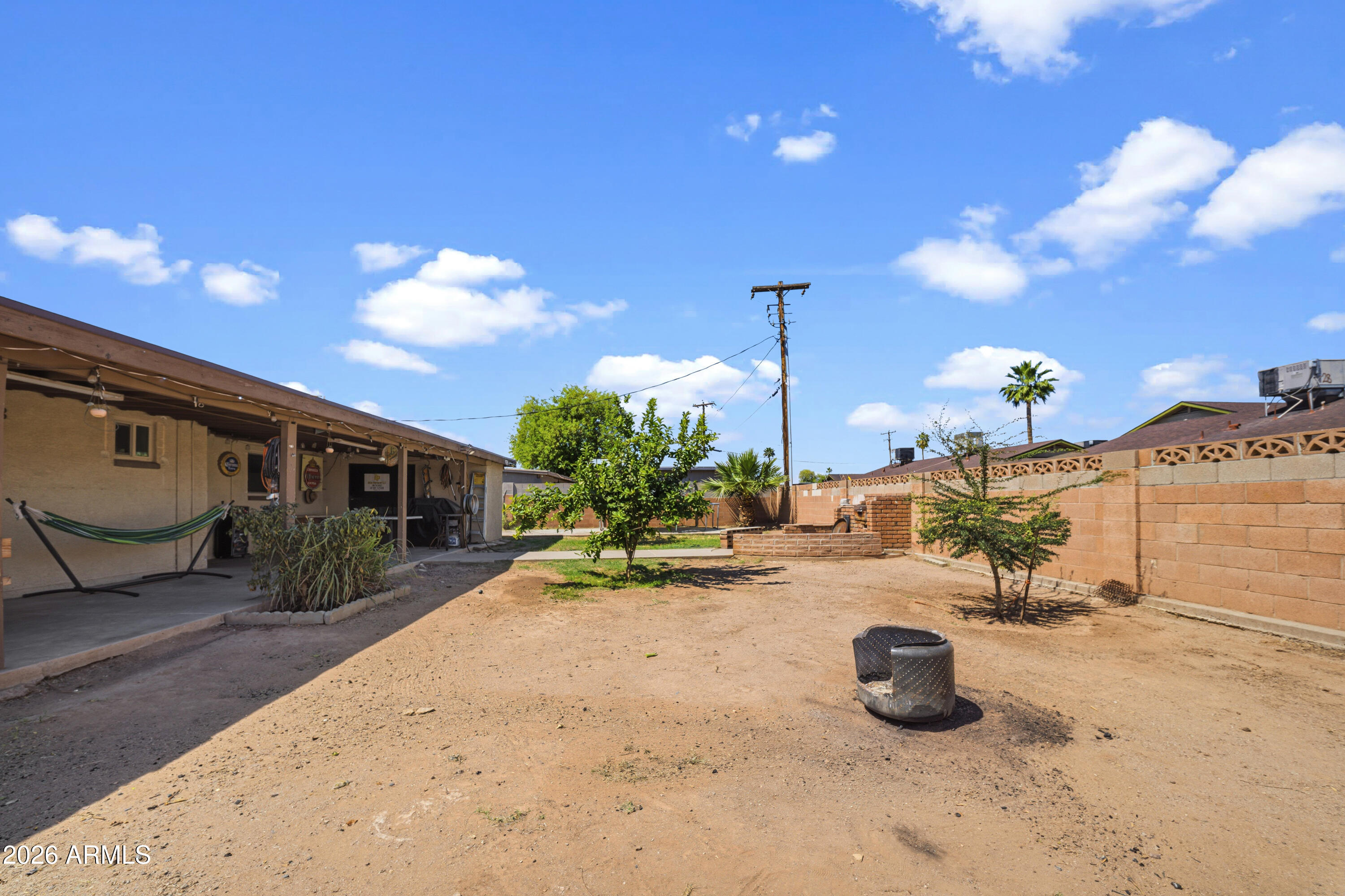 3902 West Monte Vista Road Phoenix, AZ 85009 - Photo 22 of 29 a view of a chair and tables in the patio