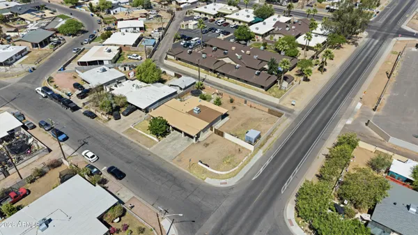 an aerial view of a residential apartment building with a yard