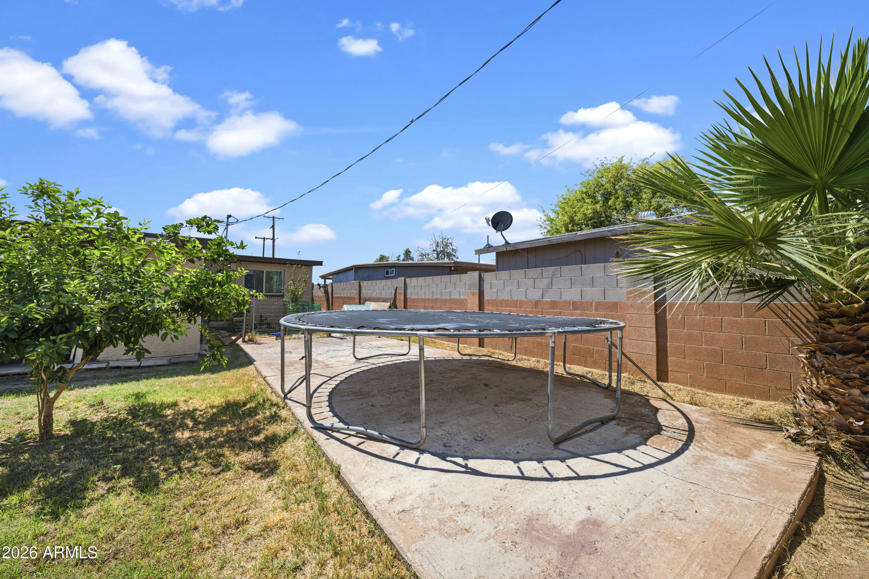 3902 West Monte Vista Road Phoenix, AZ 85009 - Photo 29 of 29 a view of a swimming pool with a yard