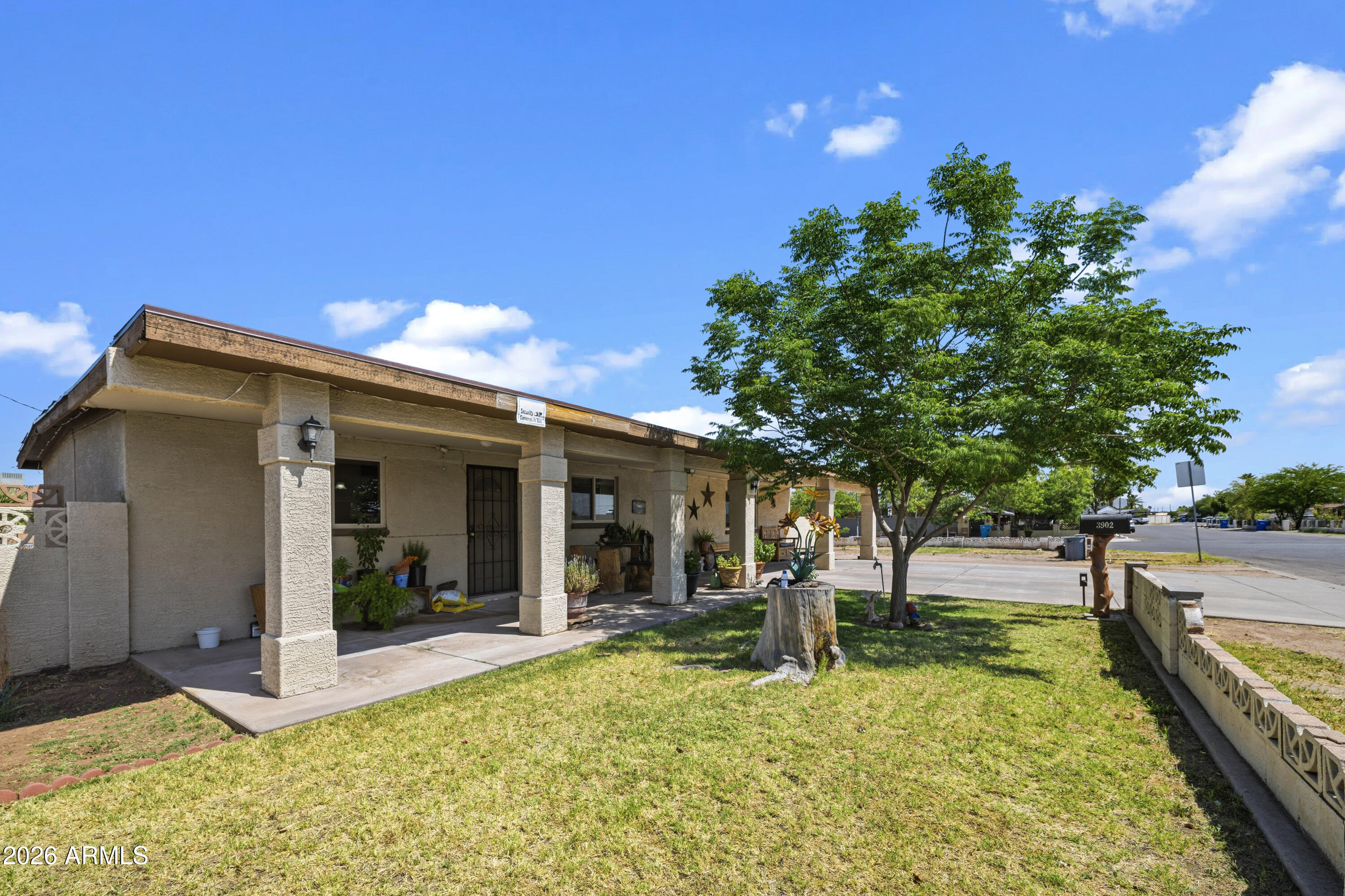 3902 West Monte Vista Road Phoenix, AZ 85009 - Photo 3 of 29 a view of a house with yard and sitting area