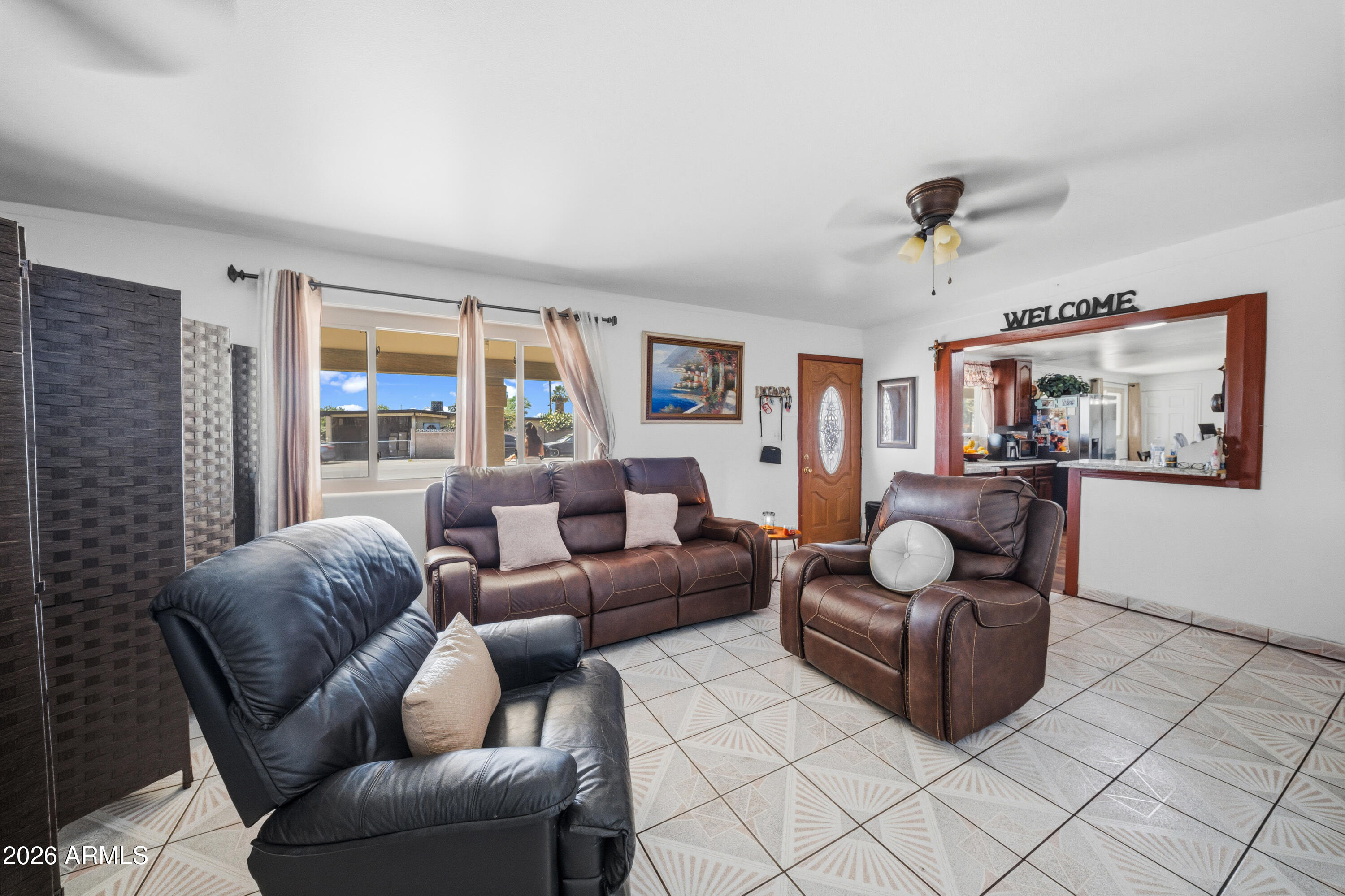 3902 West Monte Vista Road Phoenix, AZ 85009 - Photo 10 of 29 a living room with furniture and a large window