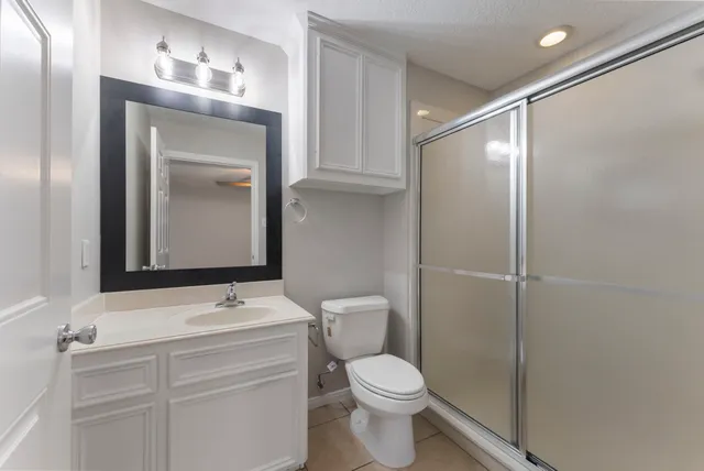 a view of a house with backyard porch and sitting area