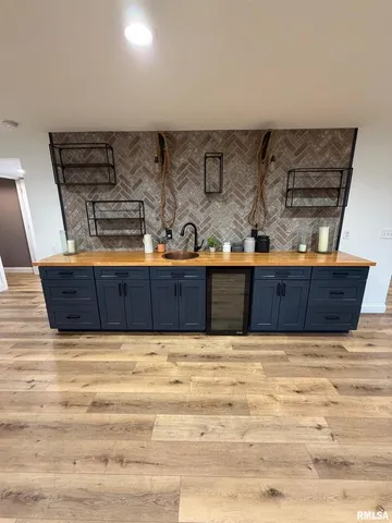 a room with wooden floor and furniture