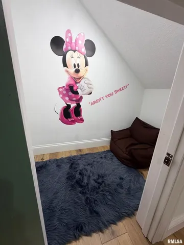 a view of a living room with a wooden floor