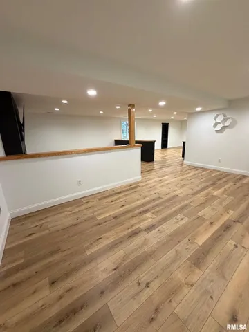 a view of a room with wooden walls