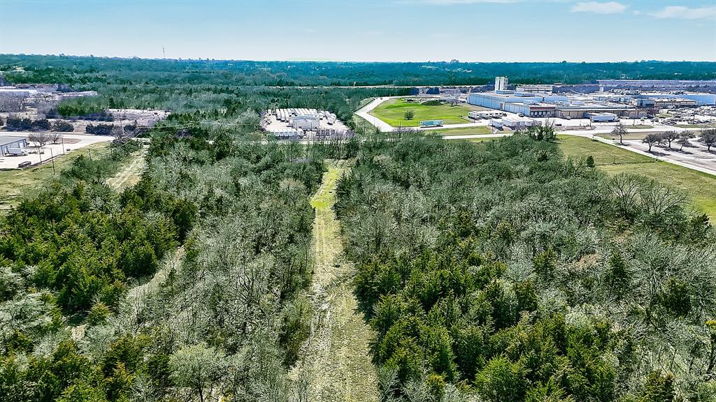 an aerial view of residential house with outdoor space and swimming pool
