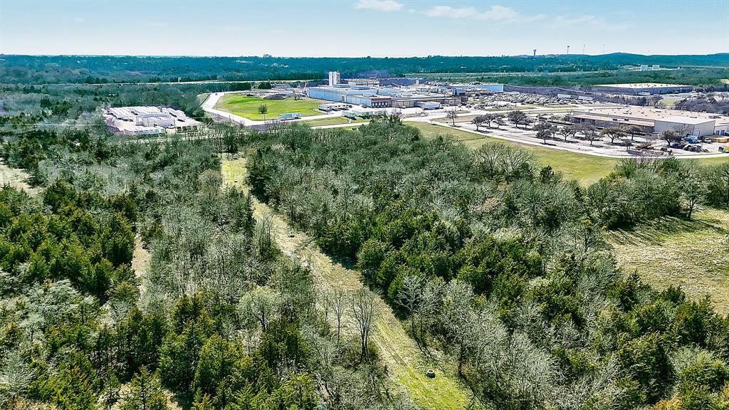 0 Fm-84 Denison, TX 75020 - Photo 2 of 9 an aerial view of a house with a swimming pool yard and mountain view in back