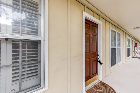 a view of a balcony and a door