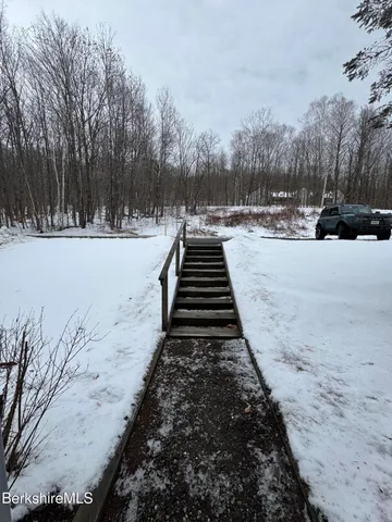 a view of a backyard with snow