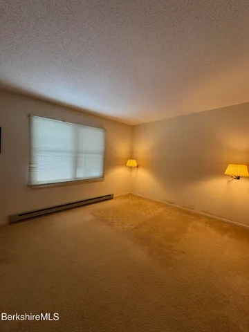 an empty room with a empty space and window