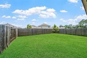 a view of a backyard of the house
