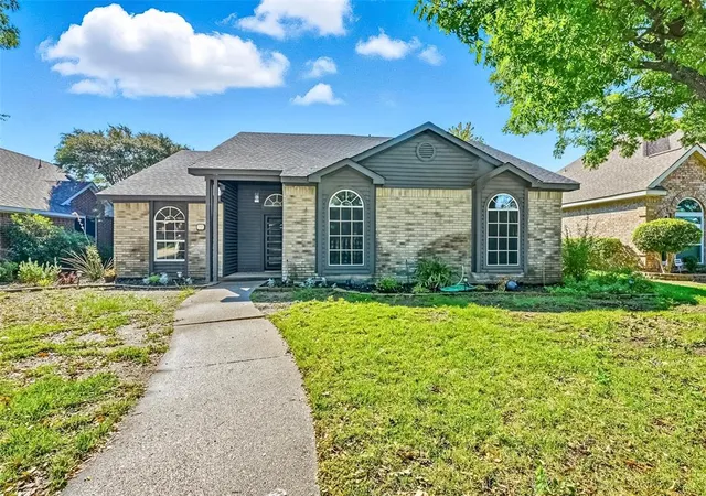 a front view of a house with yard