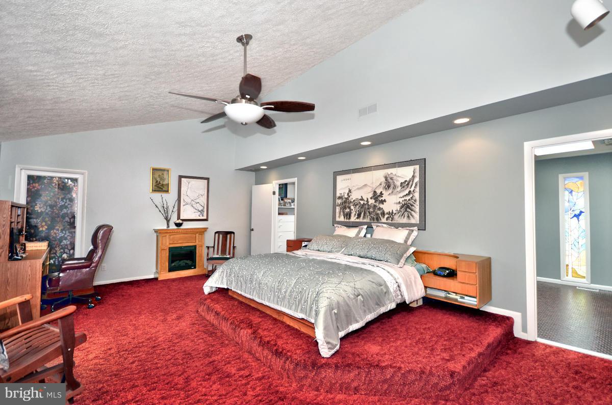 13912 Glen High Road Baldwin, MD 21013 - Photo 14 of 28 a bedroom with a bed and a chandelier