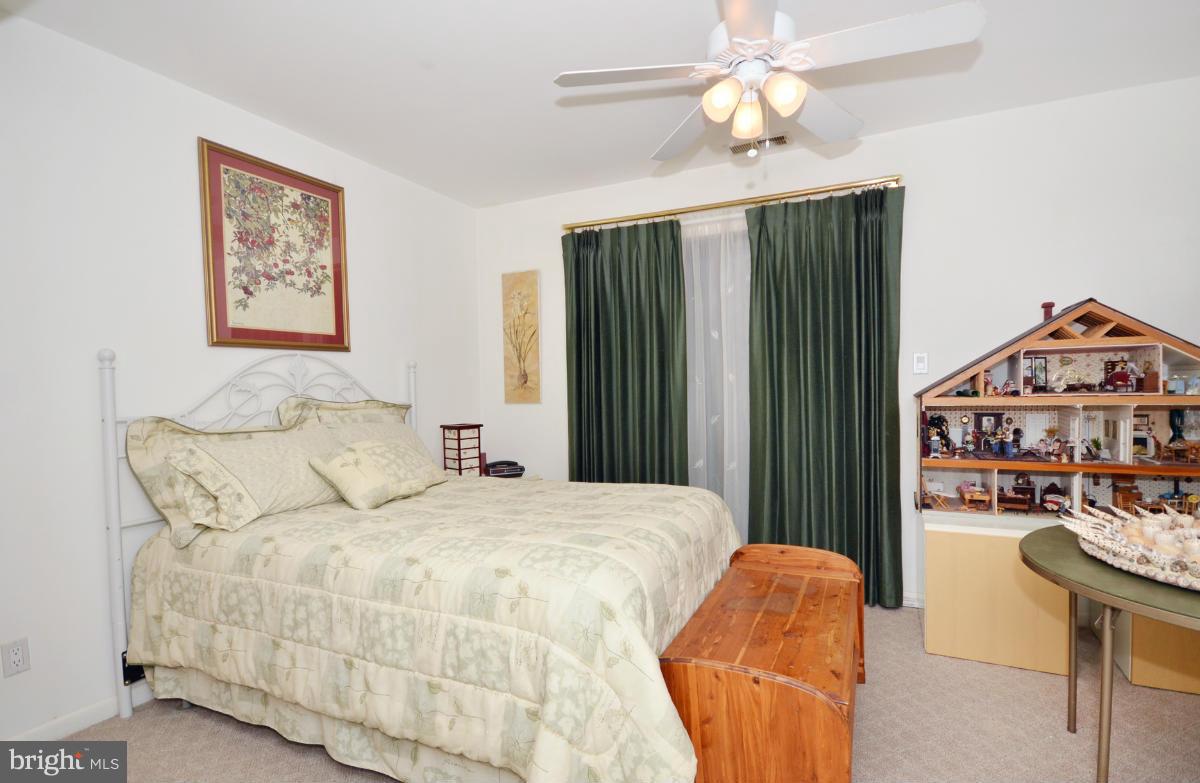 13912 Glen High Road Baldwin, MD 21013 - Photo 17 of 28 a bedroom with a bed and a chandelier