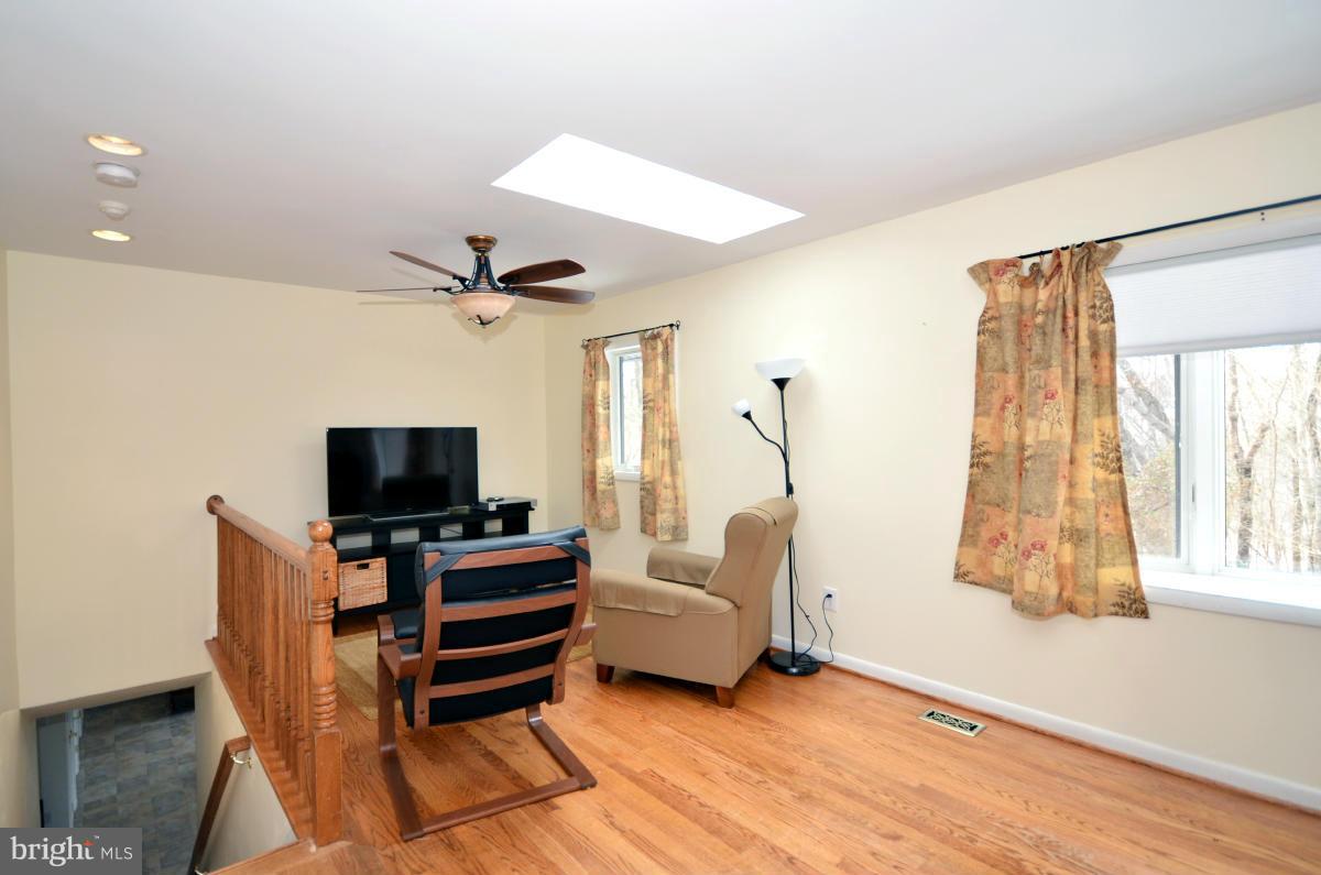 13912 Glen High Road Baldwin, MD 21013 - Photo 23 of 28 a living room with furniture and a flat screen tv
