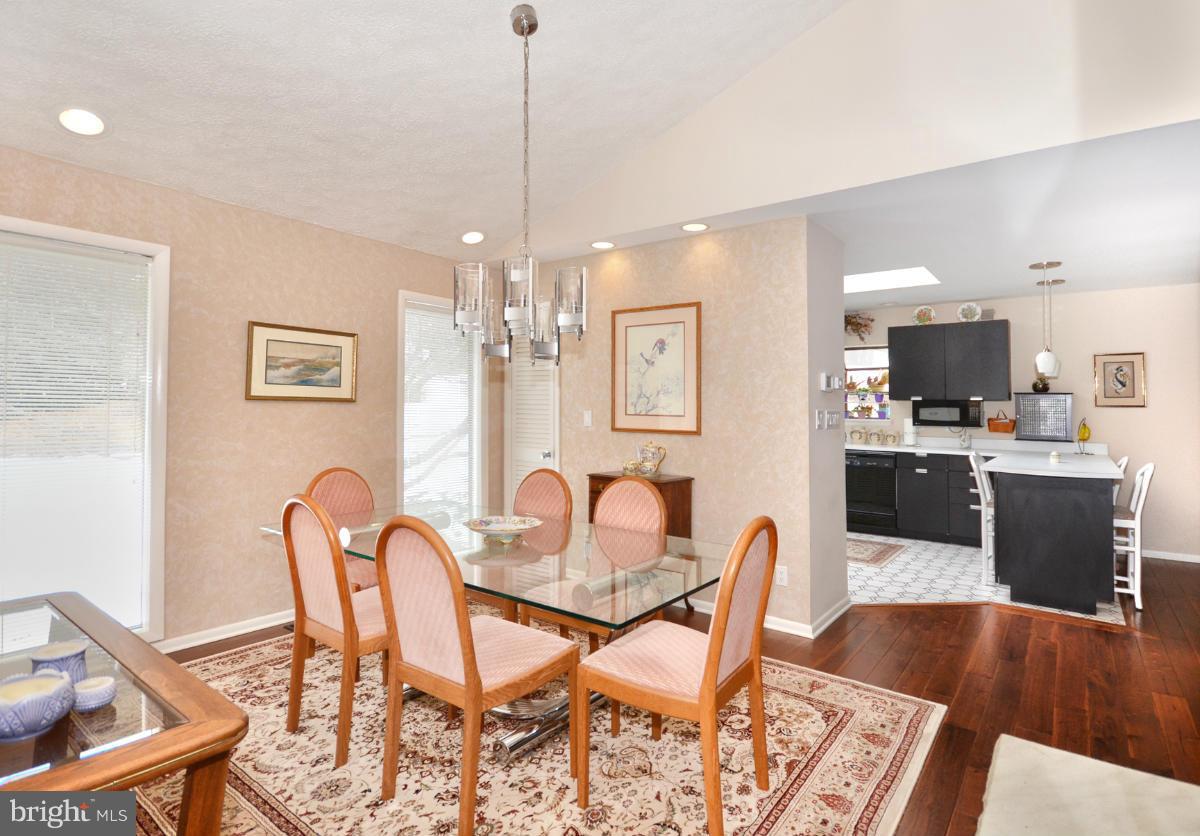 13912 Glen High Road Baldwin, MD 21013 - Photo 5 of 28 a dining room with furniture a chandelier and wooden floor