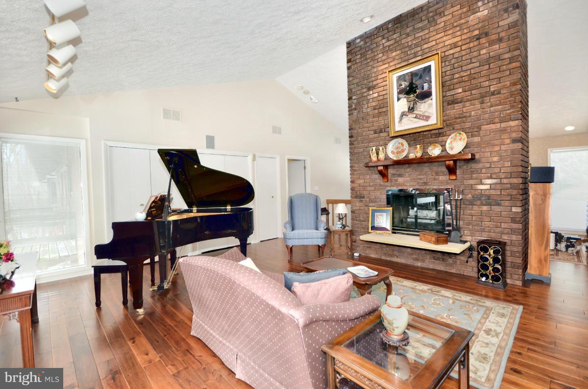 13912 Glen High Road Baldwin, MD 21013 - Photo 7 of 28 a living room with furniture and wooden floor