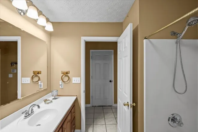 a bathroom with a sink a vanity and a mirror