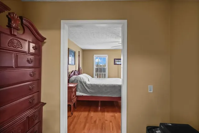 a view of living room with furniture and wooden floor