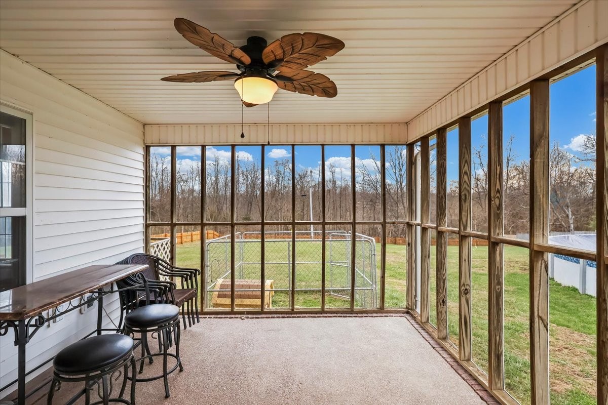2981 Rocky Hill Road Smiths Grove, KY 42171 - Photo 24 of 31 a view of a livingroom with furniture and floor to ceiling window