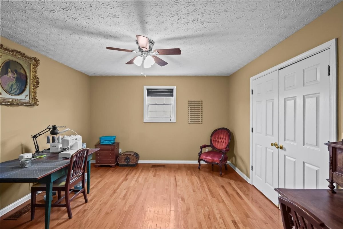 2981 Rocky Hill Road Smiths Grove, KY 42171 - Photo 30 of 31 a view of a workspace with furniture and wooden floor