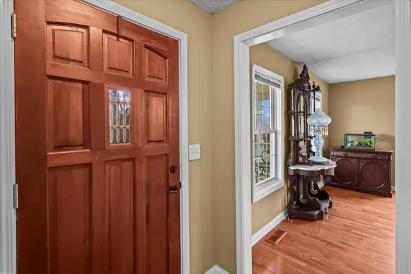 a view of a hallway with seating area
