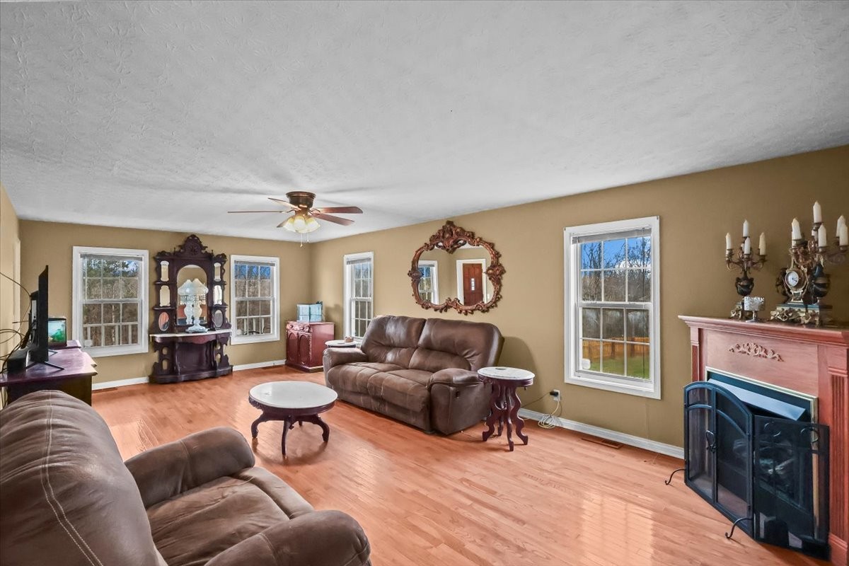 2981 Rocky Hill Road Smiths Grove, KY 42171 - Photo 6 of 31 a living room with furniture and a fireplace