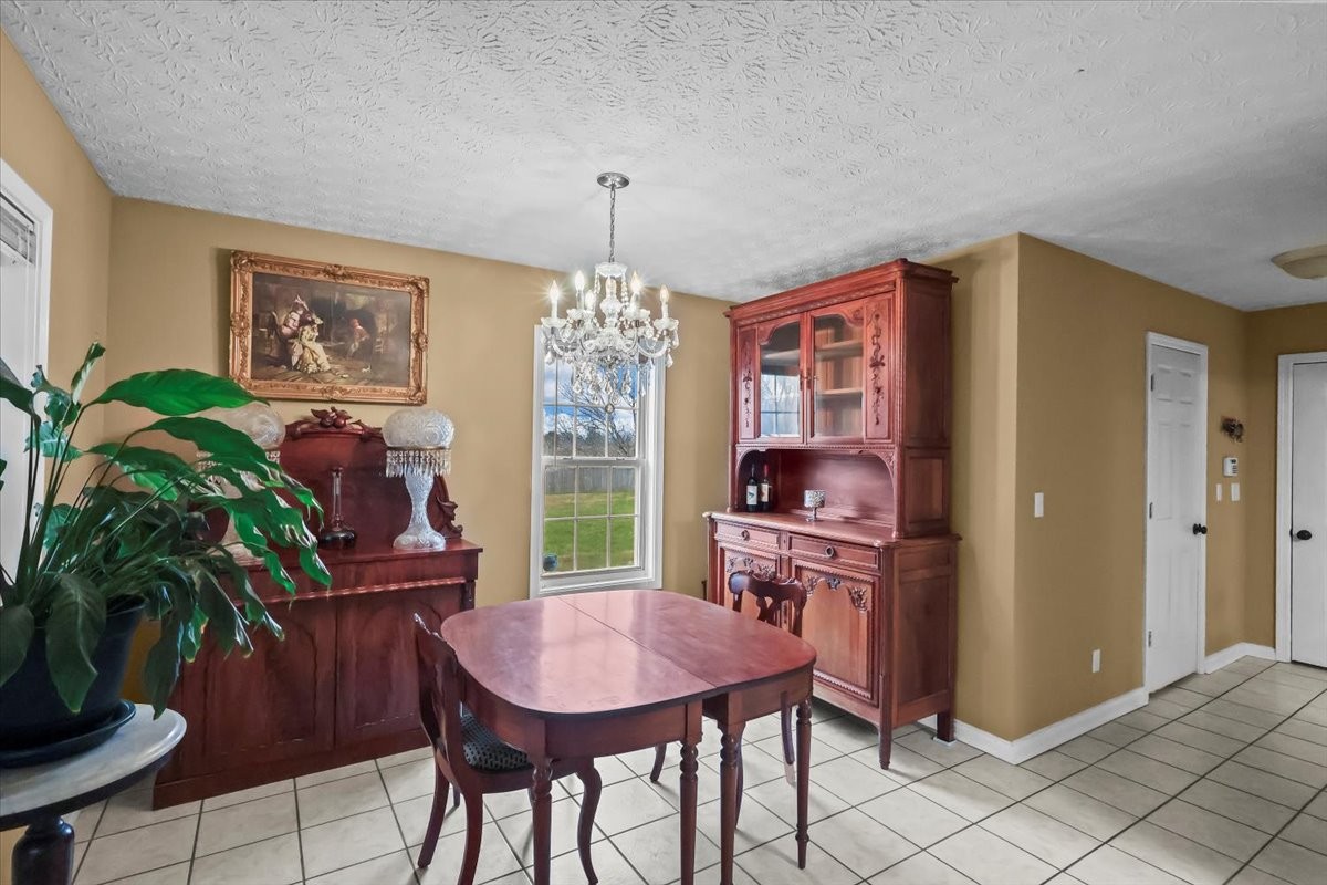 2981 Rocky Hill Road Smiths Grove, KY 42171 - Photo 8 of 31 a view of a dining room with furniture window and outside view