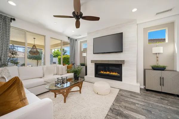 a living room with furniture and a fireplace