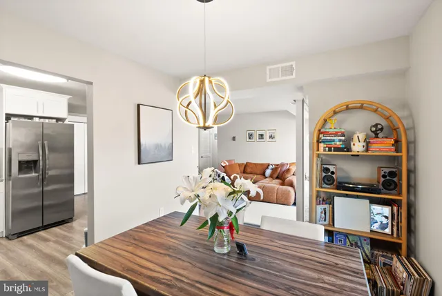 a bedroom with furniture and a book shelf