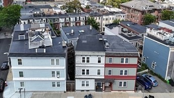84 Emerson Street, Unit 2 Boston, MA 02127 - Photo 12 of 18 a front view of a building with parking