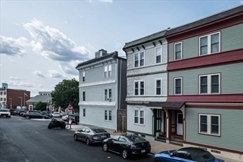 84 Emerson Street, Unit 2 Boston, MA 02127 - Photo 16 of 18 a car parked in front of a building