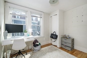 84 Emerson Street, Unit 2 Boston, MA 02127 - Photo 5 of 18 a room that has a couch and a window