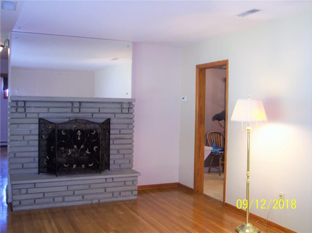 ANOTHER VIEW OF LIVING ROOM WITH ACCESS TO DINING ROOM