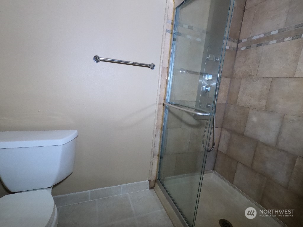 422 South 26th Street Renton, WA 98055 - Photo 14 of 24 a bathroom with a toilet and shower