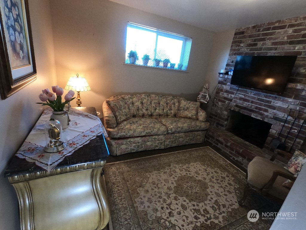 422 South 26th Street Renton, WA 98055 - Photo 18 of 24 a living room with furniture and a fireplace
