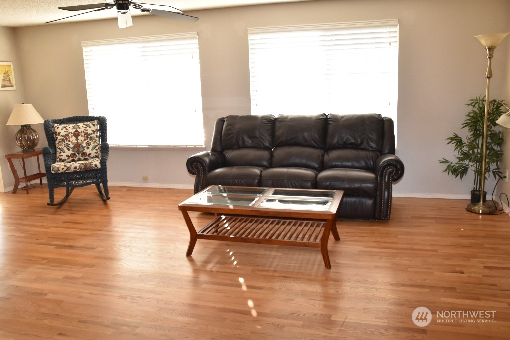 422 South 26th Street Renton, WA 98055 - Photo 4 of 24 a living room with furniture and a wooden floor