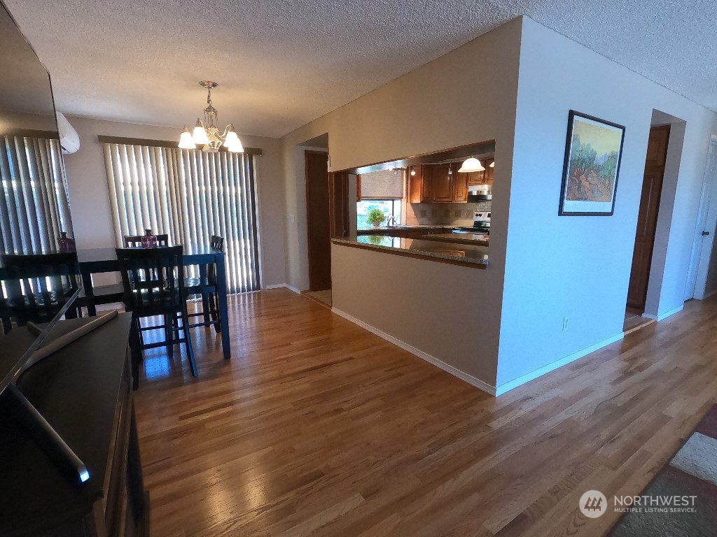 422 South 26th Street Renton, WA 98055 - Photo 5 of 24 a view of a dining room with furniture wooden floor and chandelier