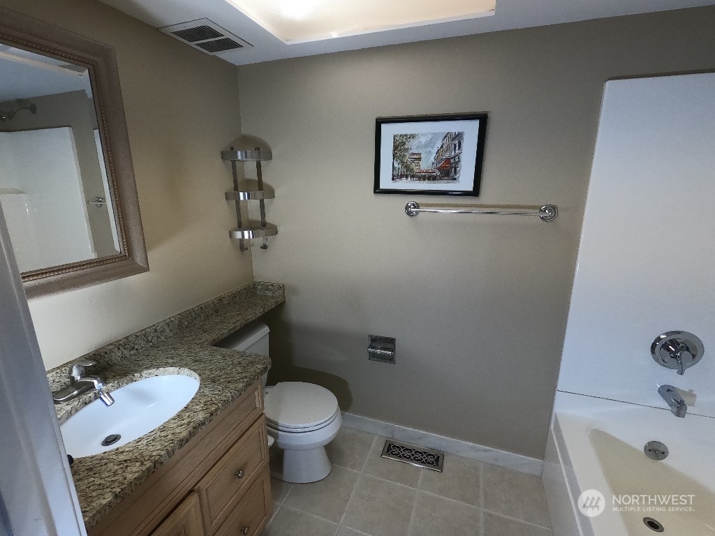 422 South 26th Street Renton, WA 98055 - Photo 10 of 24 a white toilet sitting next to a bath tub