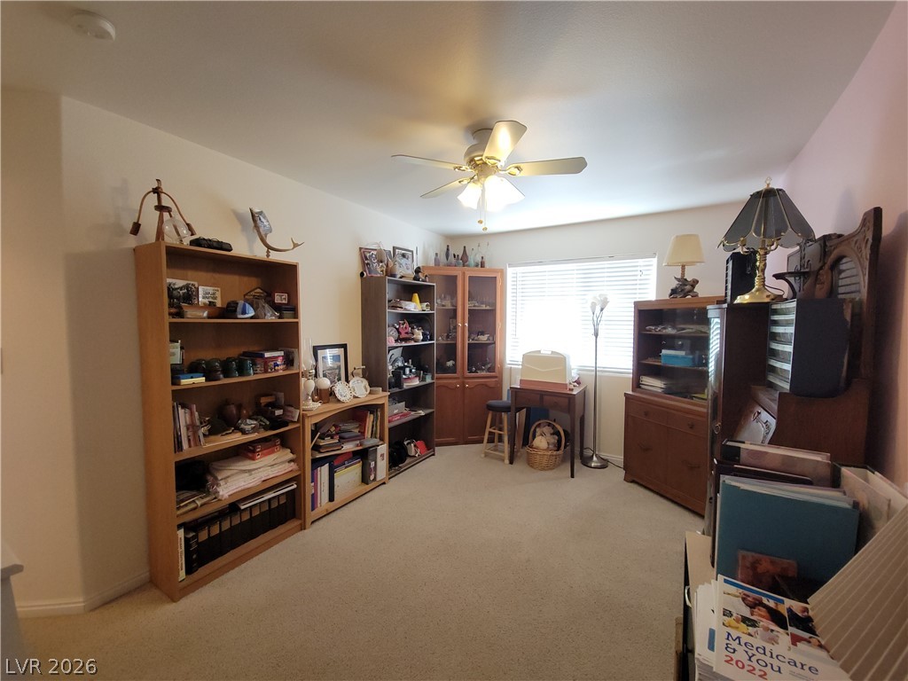 768 Weiser Ridge Street Overton, NV 89040 - Photo 21 of 37 Bedroom 3with light carpet, a closet, and a ceiling fan