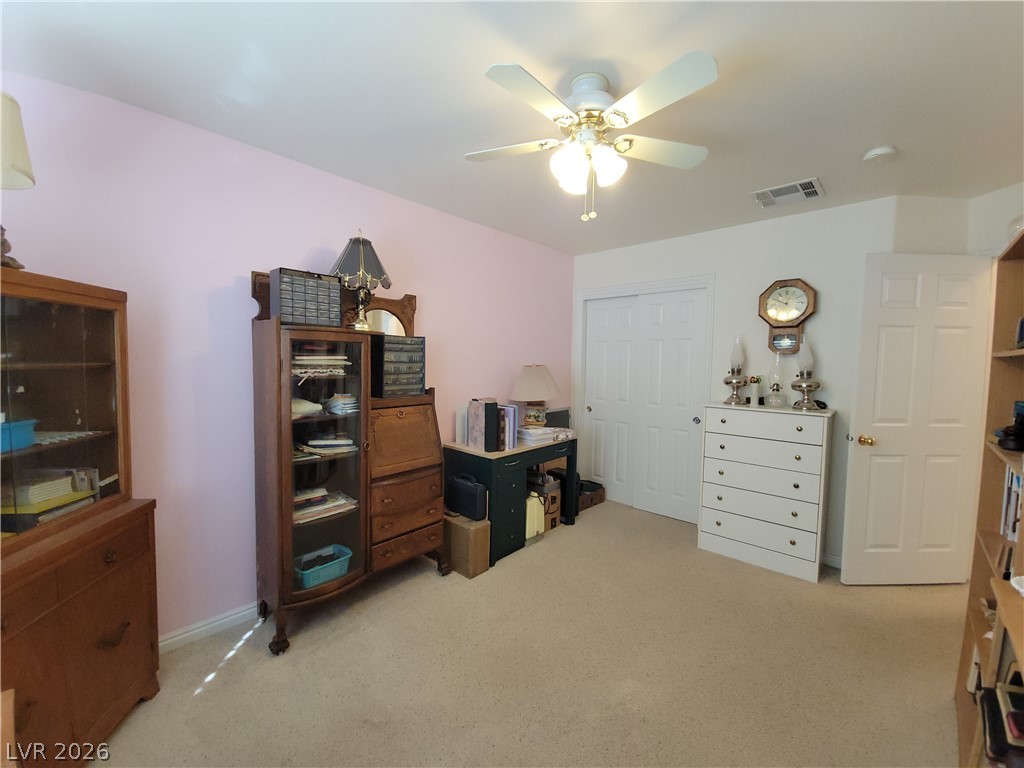 768 Weiser Ridge Street Overton, NV 89040 - Photo 22 of 37 Bedroom 3 with light carpet, a closet, and a ceiling fan