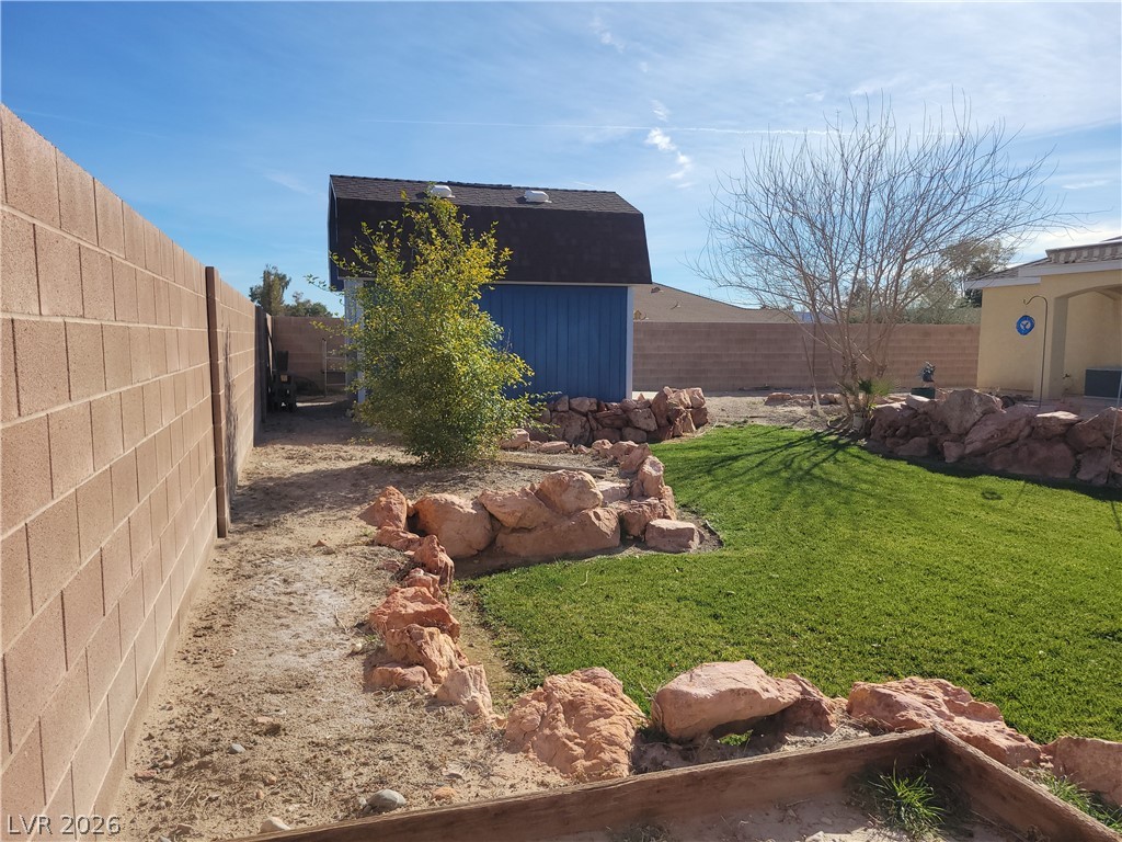 768 Weiser Ridge Street Overton, NV 89040 - Photo 30 of 37 Fenced backyard with a storage unit